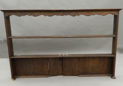 An oak dresser rack. 164.5 cm wide.