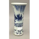 A Chinese porcelain blue and white figurally decorated vase. 24 cm high.