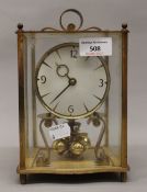 A four ball brass Anniversary clock. 21 cm high.