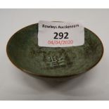A small Chinese bronze bowl. 2 cm high; 6 cm diameter.