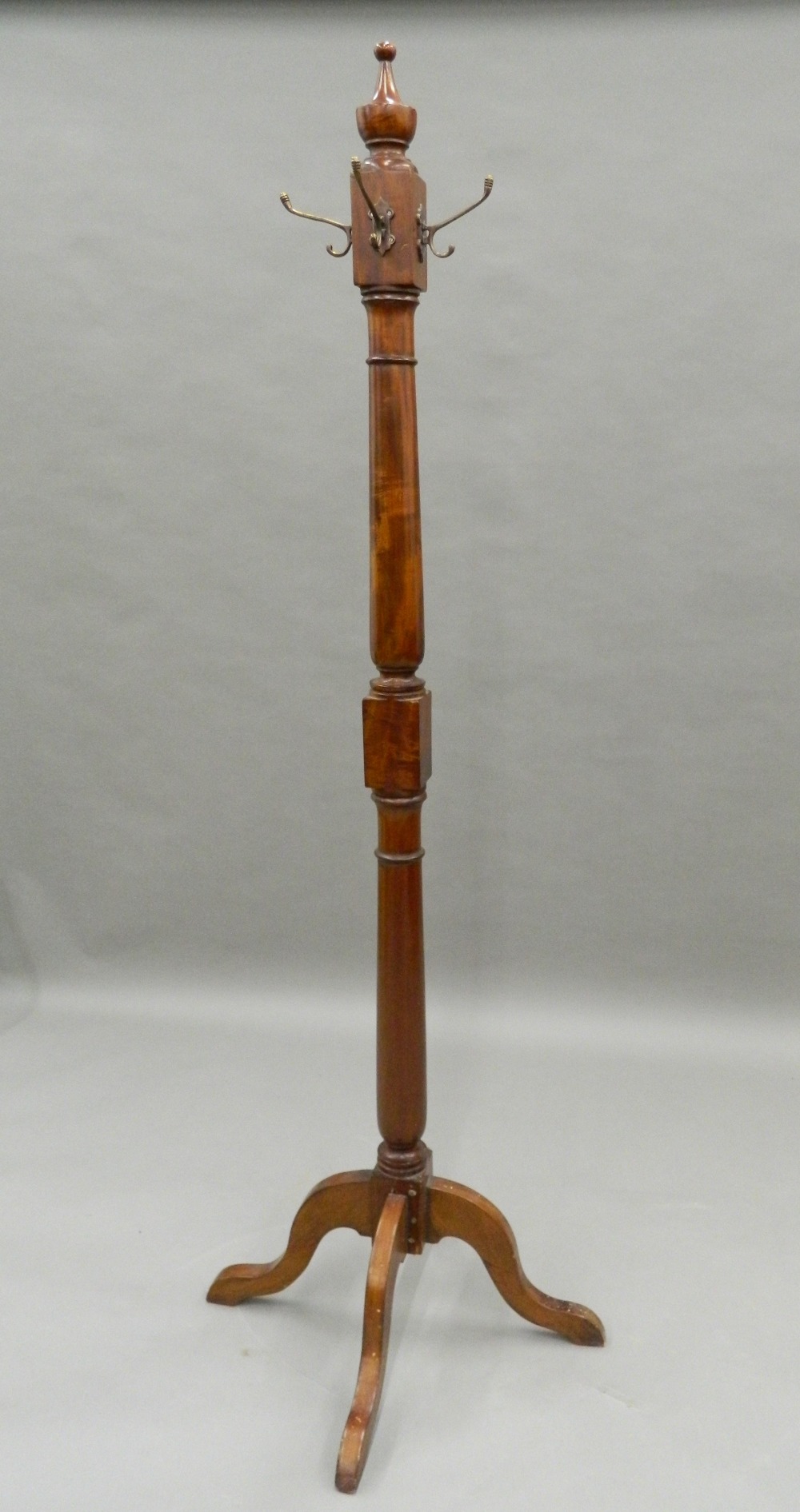 A mahogany hat stand. 170 cm high.