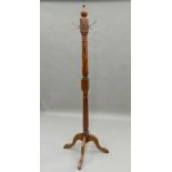 A mahogany hat stand. 170 cm high.