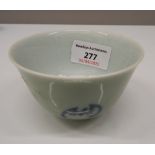 A Chinese celadon tea bowl decorated with bats. 5.5 cm high; 9 cm diameter.