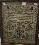 A 19th century sampler worked with a verse, trees and butterflies, etc.