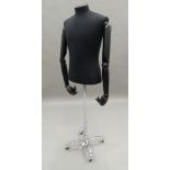 A dress makers mannequin, on stand. 140 cm high.