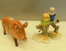 A Royal Doulton pig and a Royal Doulton pair of budgerigar. The pig 15 cm long.