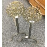 A pair of brass mounted iron fire dogs. 51 cm high.