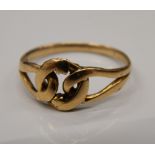 A 9 ct gold lover's knot ring. Ring size L/M (2.2 grammes).