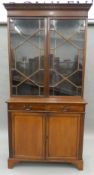 An Edwardian mahogany bookcase cabinet. 105 cm wide.