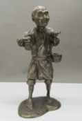 A Japanese Meiji period silvered figure of an elderly gentleman. 28 cm high.