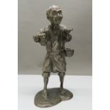 A Japanese Meiji period silvered figure of an elderly gentleman. 28 cm high.