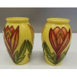 A pair of small yellow ground Moorcroft vases. 10 cm high.