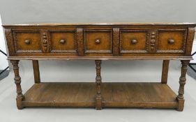 A 17th/18th century style oak dresser base. 167 cm wide.