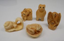 Five bone carved netsukes. Tallest 3 cm high.