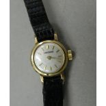 A ladies 9 ct gold Longines watch. 1.2 cm wide.