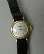 A ladies 9 ct gold Longines watch. 1.2 cm wide.