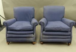 A pair of early 20th century upholstered armchairs. 85 cm wide.