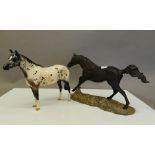 A Royal Doulton Black Bess and a dapple horse. The former 30 cm long.