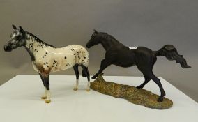 A Royal Doulton Black Bess and a dapple horse. The former 30 cm long.