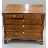 A Georgian mahogany bureau. 107 cm wide.