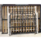 A Victorian iron bedstead and another. The largest 137 cm wide.