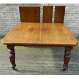 A Victorian walnut two leaf extending dining table. 240 cm long extended.