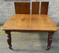 A Victorian walnut two leaf extending dining table. 240 cm long extended.