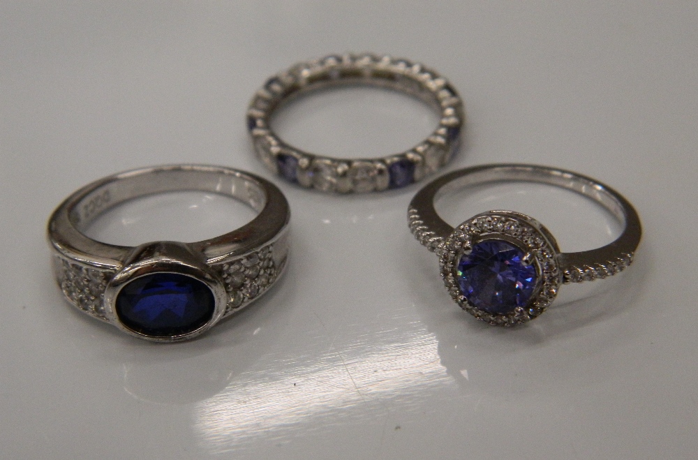 Three silver stone set rings (8.