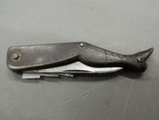 A lady's leg formed pen knife. 11 cm long extended.