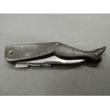 A lady's leg formed pen knife. 11 cm long extended.