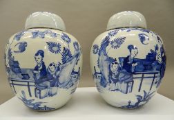 A pair of 19th century Chinese blue and white porcelain ginger jars. 30 cm high.