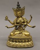 A gilt bronze deity. 17.5 cm high.