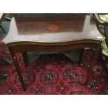 An early 20th century mahogany serpentine card table. 84 cm wide.