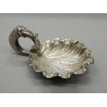 A Victorian silver vine leaf caddy spoon. 7 cm wide (12.5 grammes).