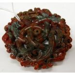 A Chinese carved agate roundel. 7 cm diameter.