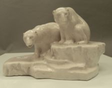 A Doulton Lambeth model of two polar bears. 32 cm wide.