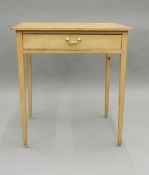A Victorian pine single drawer side table. 66 cm wide, 72 cm high, 45 cm deep.