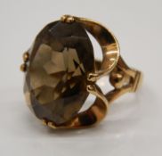 A 9 ct gold large smoky quartz ring.