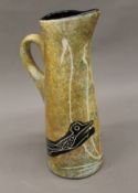 A large Mana pottery jug, signed Sri Rama Ashram in Benson Arizonia. 35 cm high.