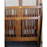 An Edwardian line inlaid mahogany double bed. 140 cm wide.