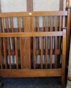 An Edwardian line inlaid mahogany double bed. 140 cm wide.