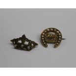 An Edwardian 15 ct gold pearl horseshoe brooch inscribed Good Luck inlaid with diamonds,