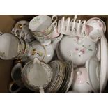 Two boxes of decorative tea sets