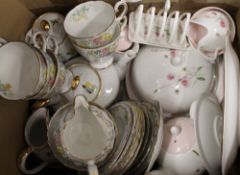 Two boxes of decorative tea sets