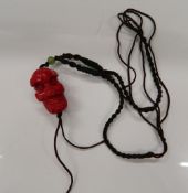 A coral skull necklace. Skull 3.25 cm high.