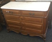 A 19th century Continental chest of drawers with a marble top. 117 cm wide, 85 cm high, 50.