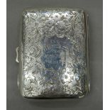 A silver cigarette case. 8.5 x 6.5 cm (72.
