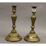 A pair of brass candlesticks. 27 cm high.