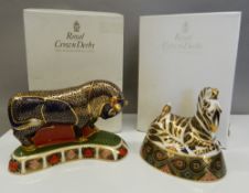 Two large boxed Royal Crown Derby paperweights, a bull and a zebra (both with stoppers).