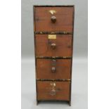 A small 19th century bank of pine drawers. 69 cm high.